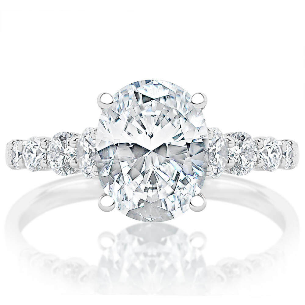 Oval Diamond Round Diamond Graduated Shank Engagement Ring