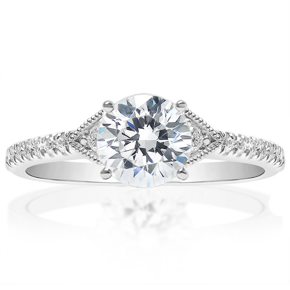 Round Diamond with sidestones Engagement Ring