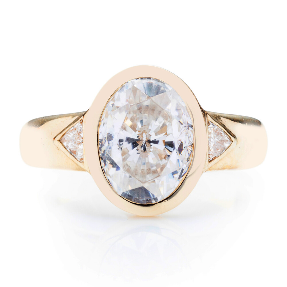 Oval and Trillion Three Stone Engagement Ring