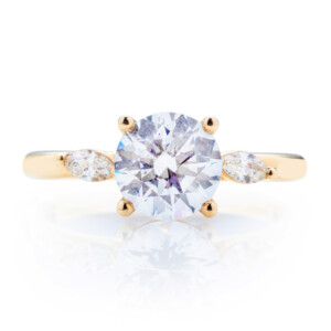 Round Diamond Slanted Accent Diamond Engagement Ring