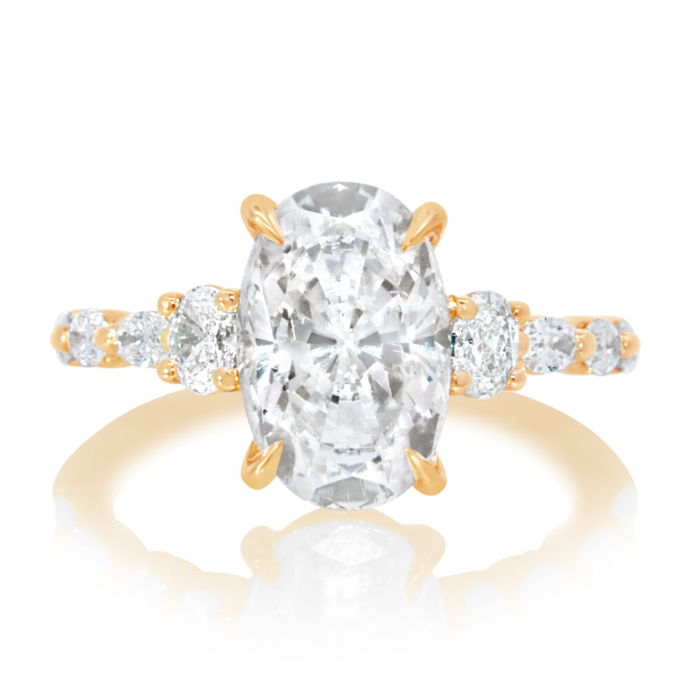 Oval Three Stone and Diamond Shank Engagement Ring